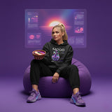 Person wearing the Mood Zen AR hoodie with QR code for AR video activation, sitting on a purple bean bag chair against a futuristic background.