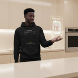 Man wearing an augmented reality black hoodie with text in a modern kitchen setting