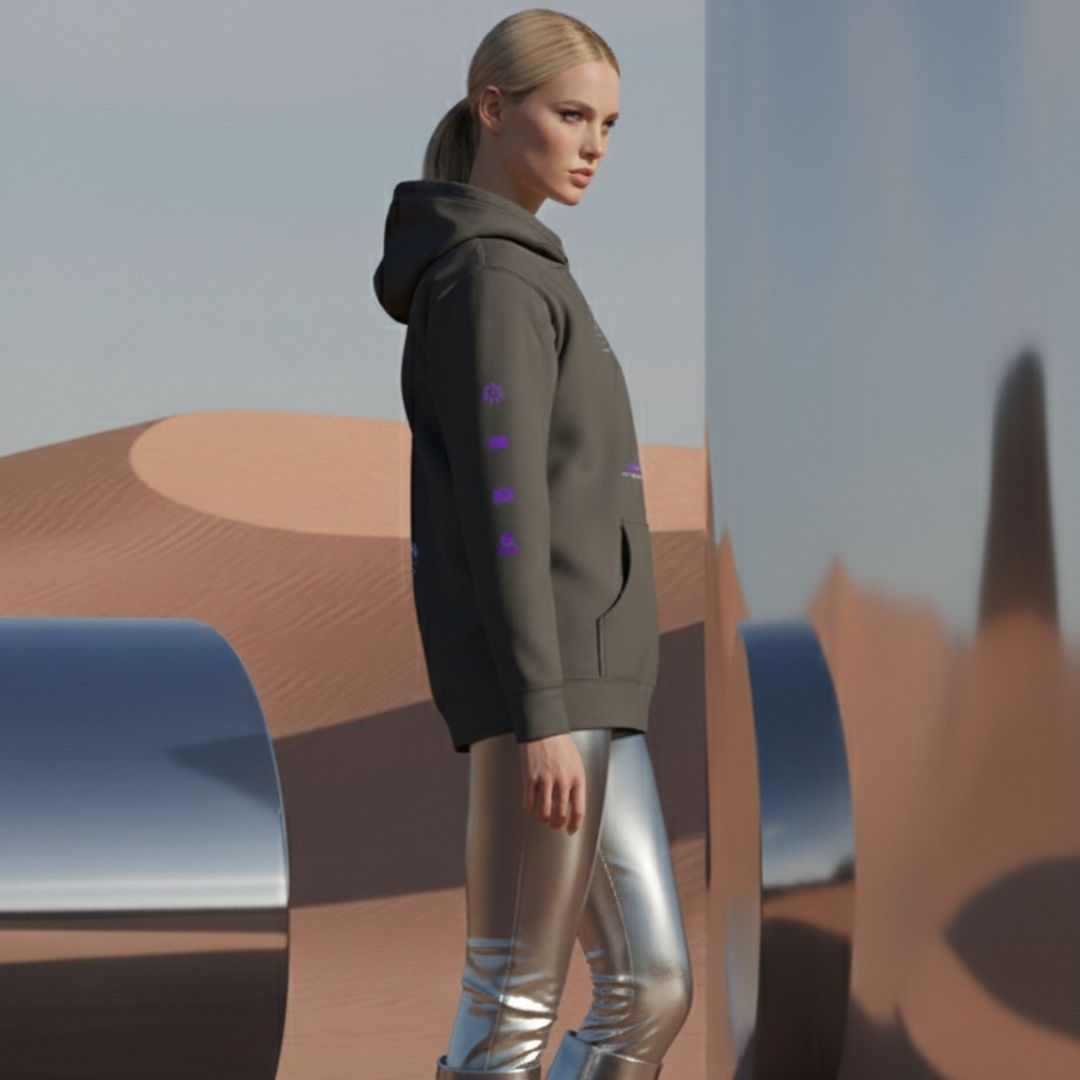 Female model wearing a vintage black hoodie with purple accents and QR code for AR video activation, in a desert-like setting